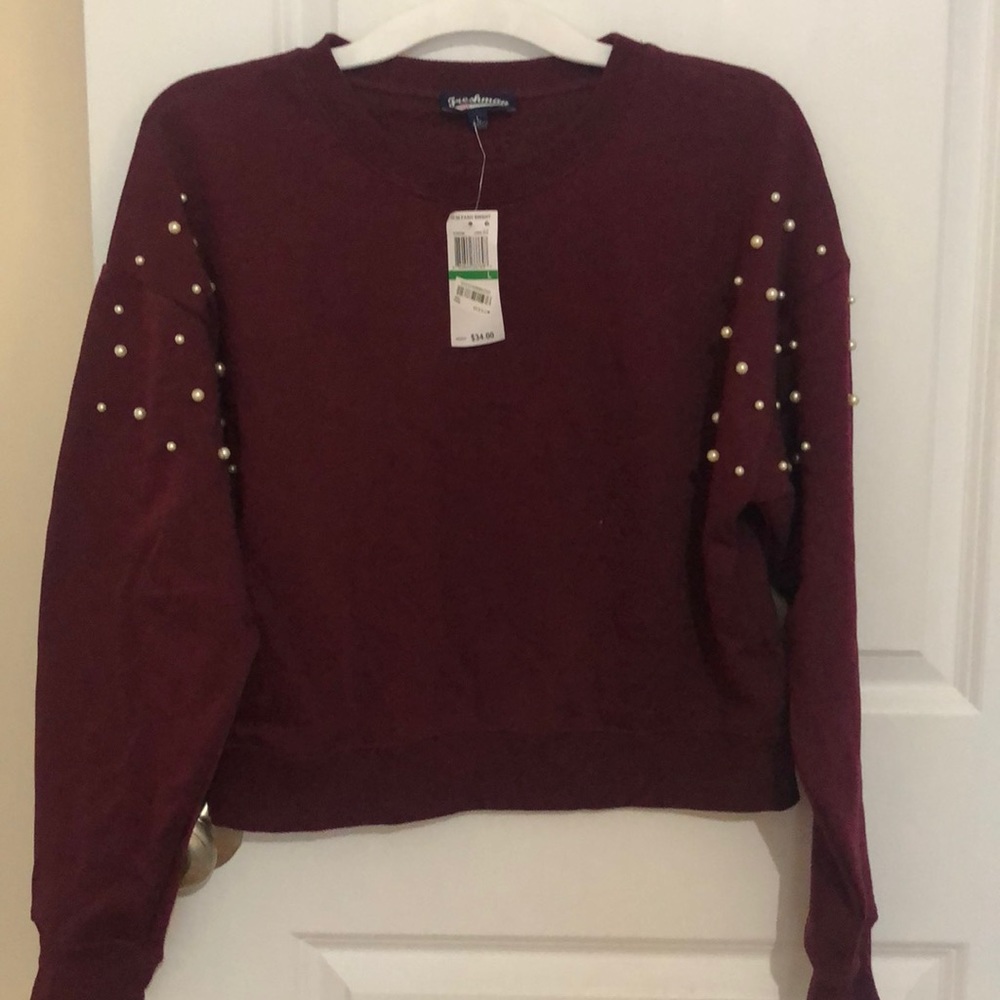 Sweater with pearls on sleeve